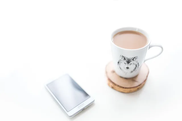 coffee, mug, white, coffee cup, wolf, mobile, phone, smartphone, cell phone, devices, technology, white desk, desk. How to run audience research for appointment setting agencies