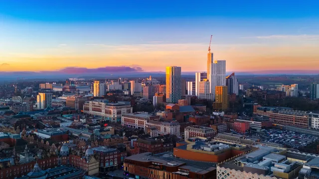Stunning aerial view of Leeds city skyline in England during sunset with vibrant colors. Leeds compared with Bristol, how clusters shape outsourced sales demand